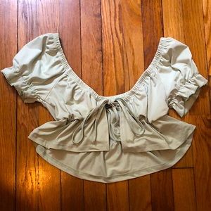 this is an over shirt/ crop top styled, tie in the front